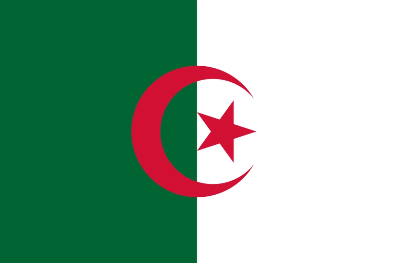 The flag of Algeria features two equal vertical bands of green and white. A five-pointed red star within a fly-side facing red crescent is centered over the two-color boundary.
