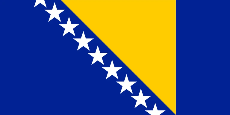 The flag of Bosnia and Herzegovina has a blue field, at the center of which is a large yellow hoist-side facing right-angled triangle that is based on the top edge and spans the height of the field. Adjacent to the hypotenuse of this triangle are nine adjoining five-pointed white stars with the top and bottom stars cut in half by the edges of the field.