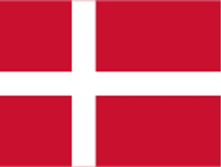 The flag of Denmark has a red field with a large white cross that extend to the edges of the field. The vertical part of this cross is offset towards the hoist side.