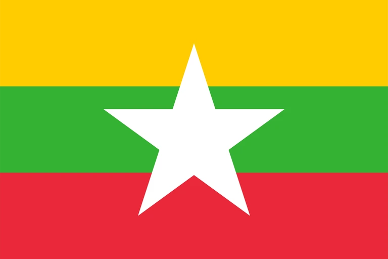 The flag of Myanmar is composed of three equal horizontal bands of yellow, green and red, with a large five-pointed white star superimposed at the center of the field.