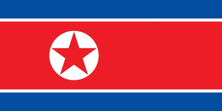 The flag of North Korea is composed of three horizontal bands — a large central white-edged red band, and a blue band above and beneath the red band. On the hoist side of the red band is a red five-pointed star within a white circle.