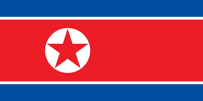 The flag of North Korea is composed of three horizontal bands — a large central white-edged red band, and a blue band above and beneath the red band. On the hoist side of the red band is a red five-pointed star within a white circle.
