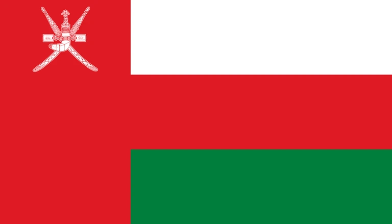 The flag of Oman features a red vertical band on the hoist side that takes up about one-fourth the width of the field, and three equal horizontal bands of white, red and green adjoining the vertical band. At the top of the vertical band is the white emblem of Oman.